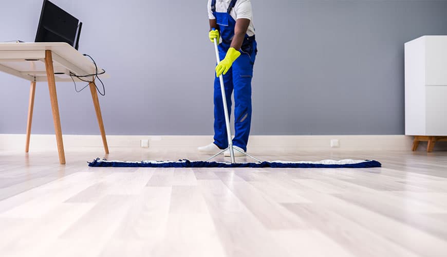 service person mopping the floor